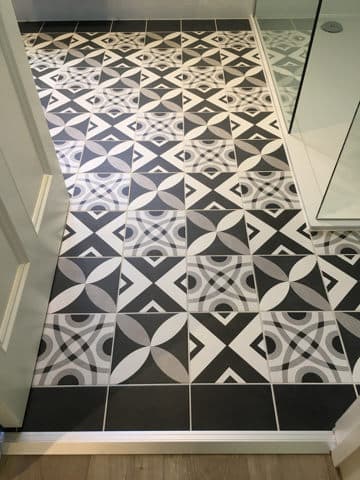 black and white patterned bathroom floor tiles laid by aylsham based tiler