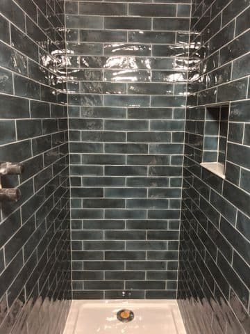 grey brick pattern tiling in shower at wood dalling