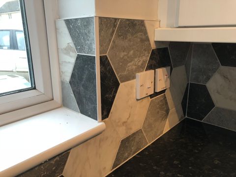 hexagon tiles in kitchen showing electrical sockets