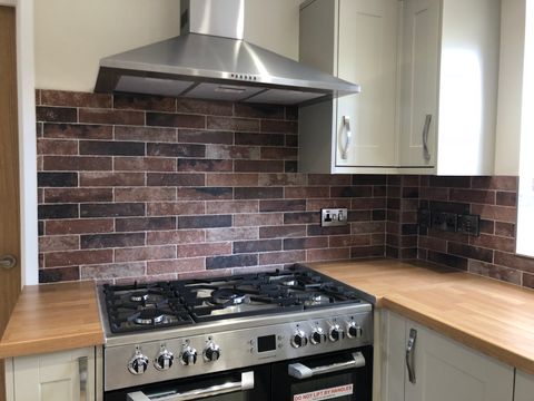 Kitchen and Utility tiling completed using Topps Hartley old Red brick tiles with limestone grout.