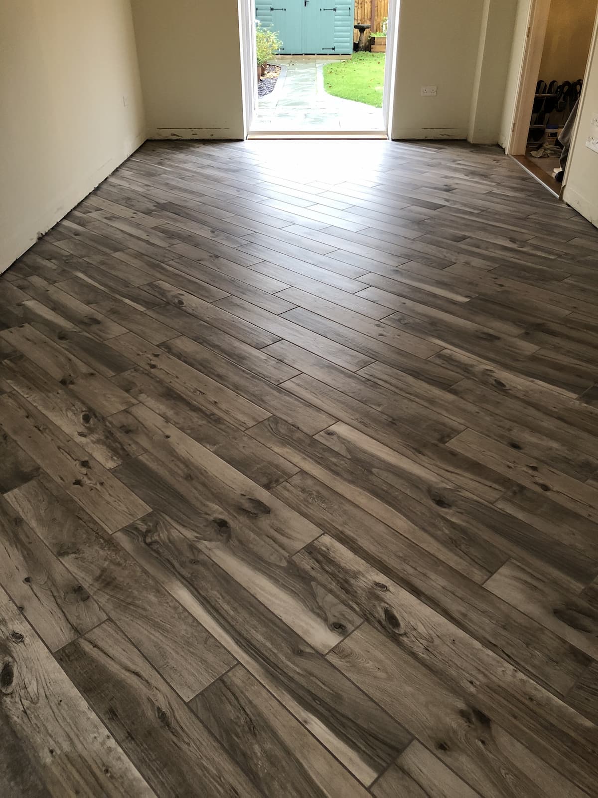 wood effect porcelain tiling for client in blofield